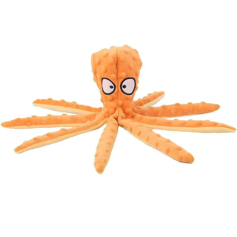 Octopus piepspeelgoed hond oranje, bovenaanzicht neergelegd — 8 tentakels uitgespreid op wit
