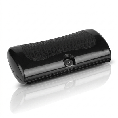 GlowBrush deshedding kam hond en kat — zwarte compacte borstel op witte achtergrond met spiegeling